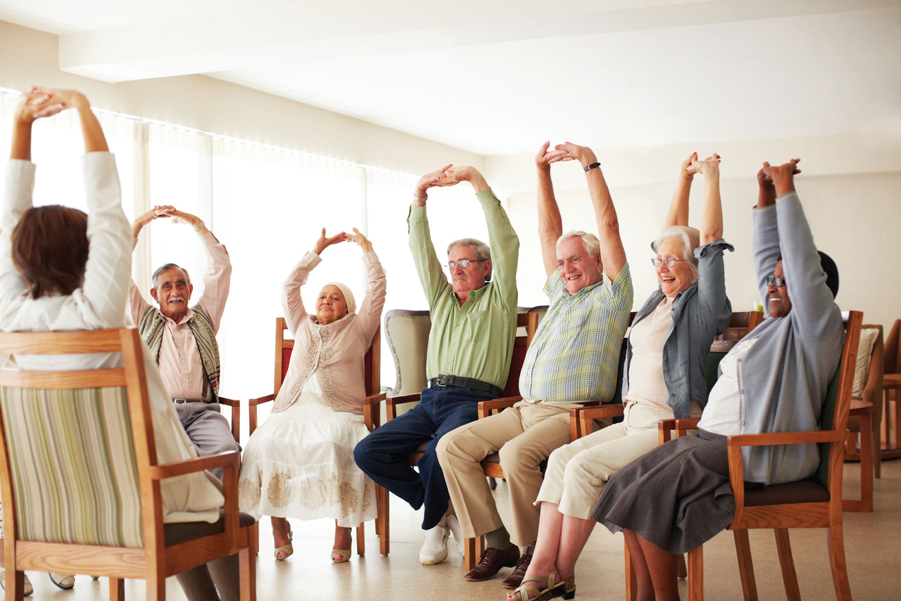 Assisted Living Facilities in Clermont - Residents in an exercise class