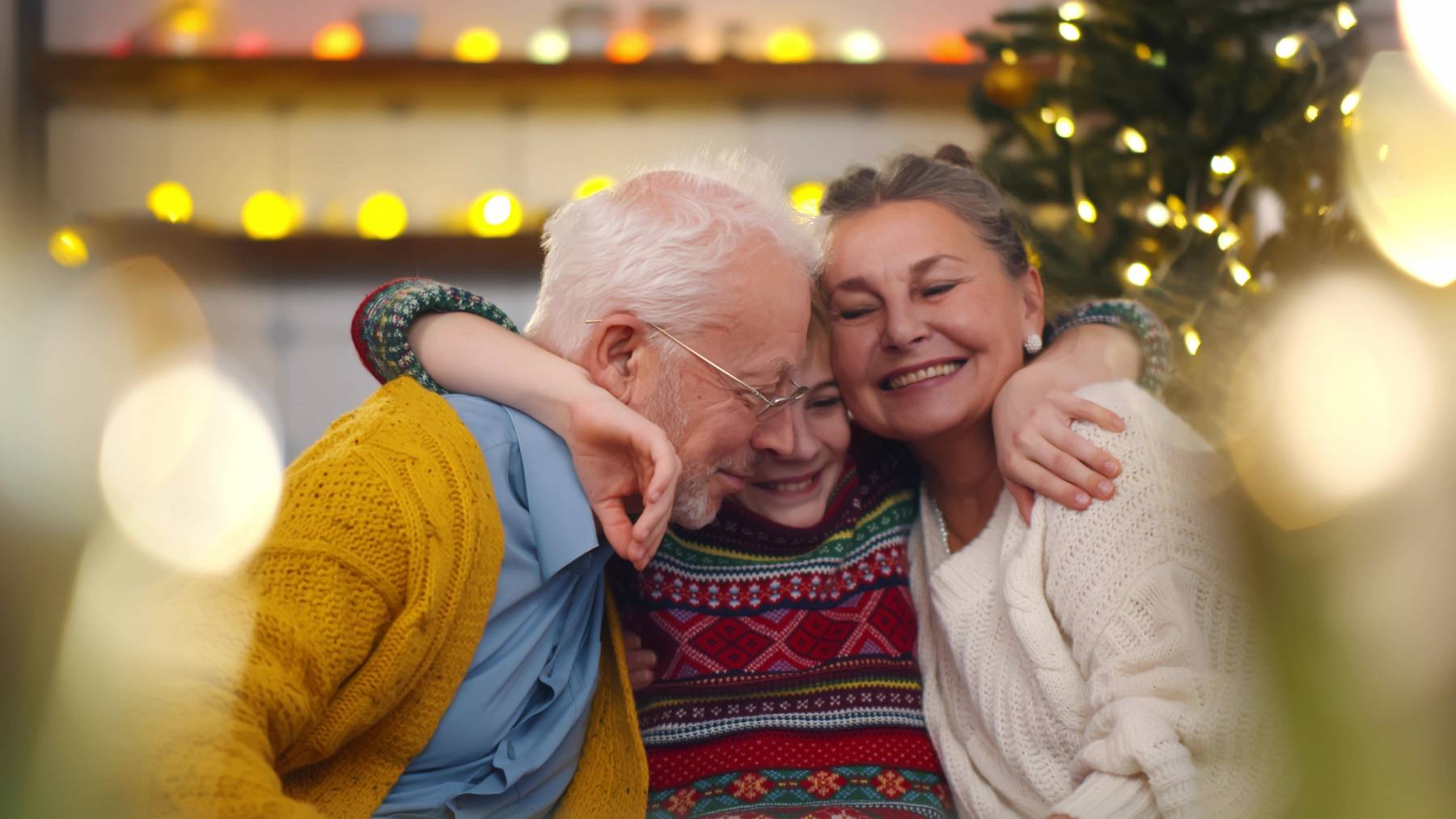 Assisted Living Residents Hugging Grandchild