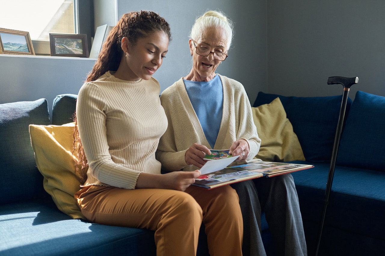 Senior Woman and Teenager Sitting Together