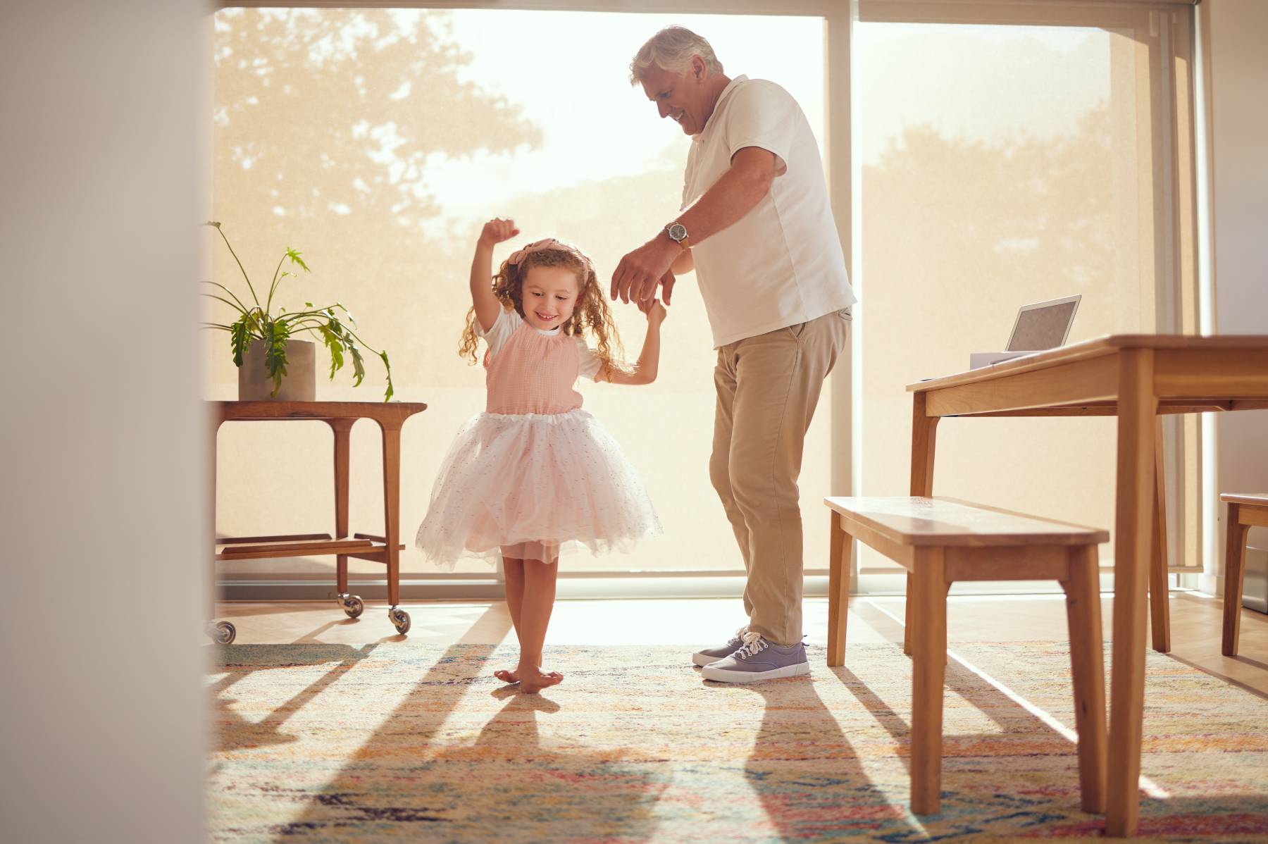 Senior Living in Georgia - Elderly Man and Child Dancing