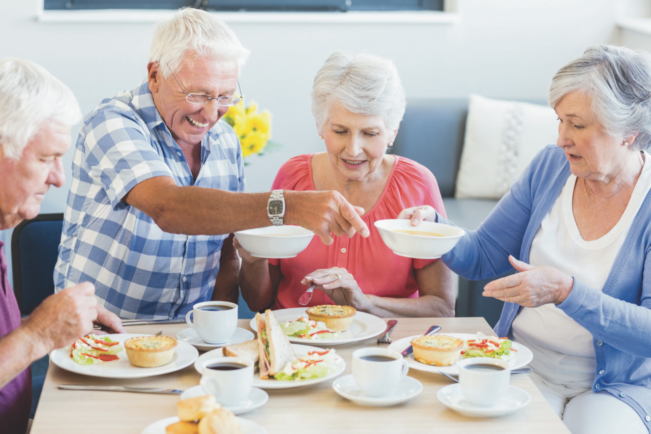 Senior Group Homes in Florida - Senior Group Indoors Sitting and Eating