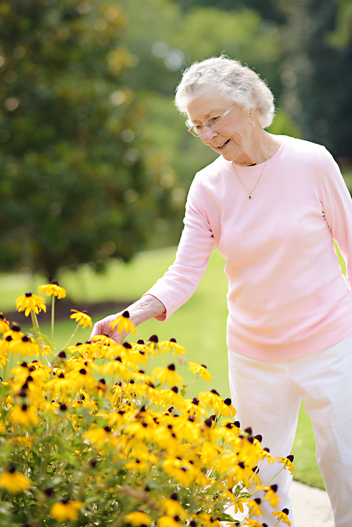 Assisted Living Resident Gardening Flowers